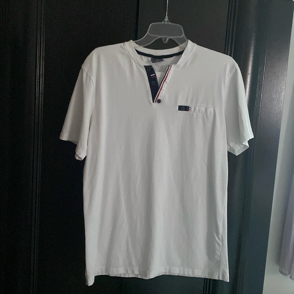 White men's T-shirt from Europe..it says xxl but fits M. I gave the dimensions